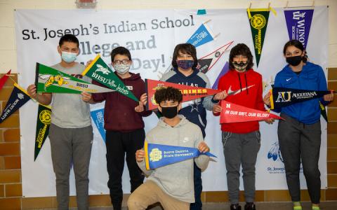 Students posing with flags