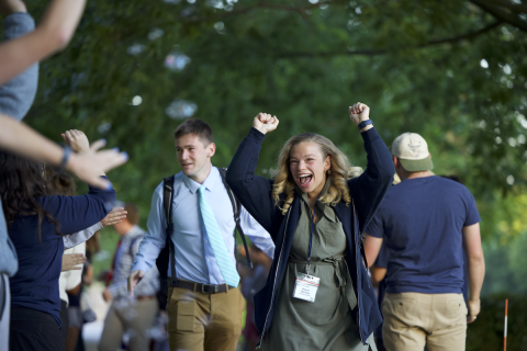 ACE teaching cheering with arms up walking out on the first day of Practicum