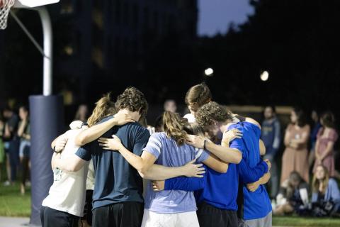 ACE Mobile and Detroit praying before basketball game