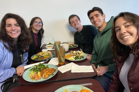 ACE Tucson community eating dinner together