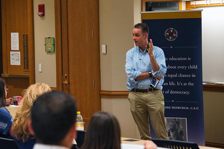 John Schoenig talking to students