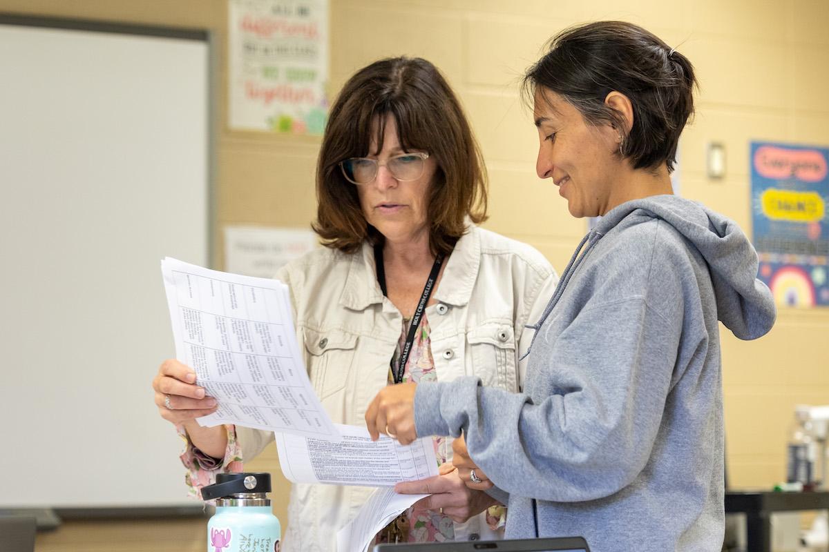 AICSN teacher talking with instructor