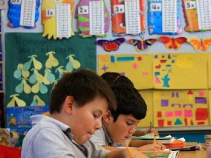 Students writing in classroom